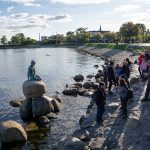 The little Mermaid statue in Copenhagen Harbour - with tourists